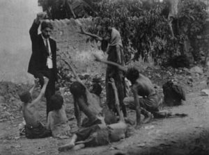 A Turkish official teases starving Armenian children with bread during the Armenian Genocide
